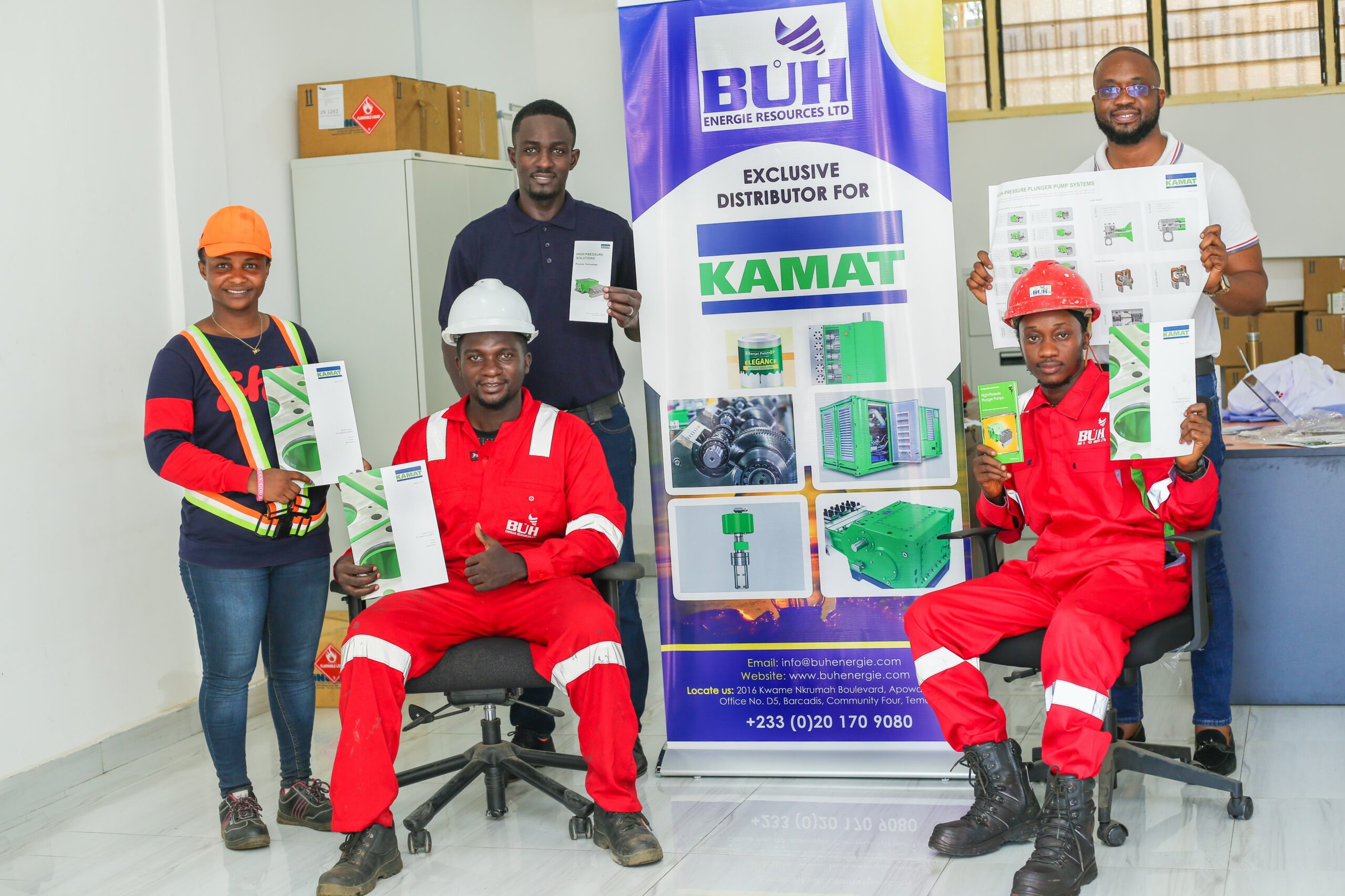 The BUH team proudly presenting KAMAT items and logo in their office in Ghana