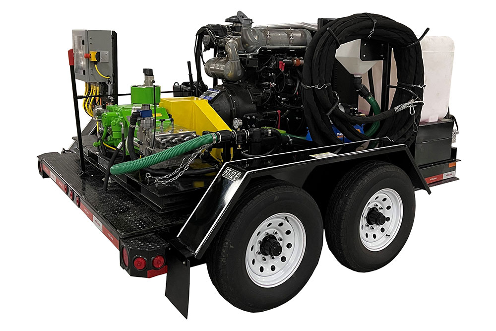 KAMAT US partner Giant Industries' product picture, where one can see a green KAMAT pump based on a trailor with two wheels as one component for a mobile high-pressure unit